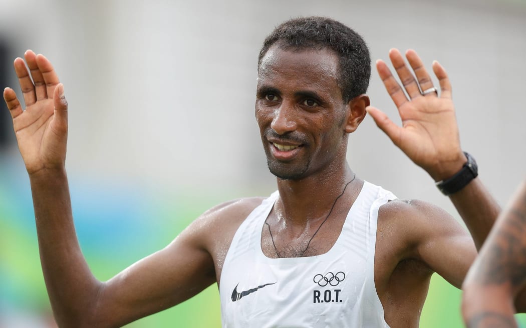 Yonas Kinde of the Refugee Olympic Team reacts after the men's marathon at the 2016 Rio Olympic Games.