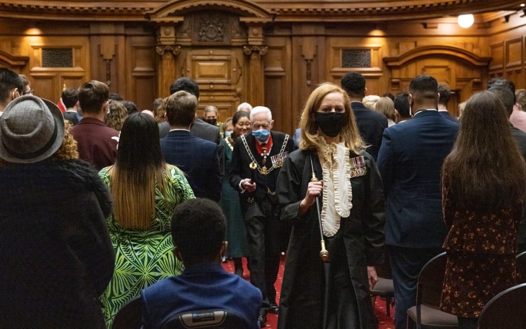 Usher of the Black Rod Sandra McKie leads the Governor General's procession out of the Legislative Council Chamber.