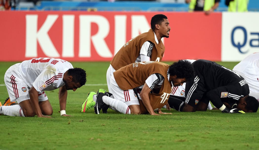 United Arab Emirates players celebrate their Asian Cup quarter-final win over Japan