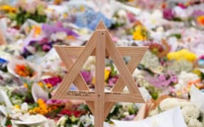 A vigil in Bondi Beach has attracted thousands in the wake of the attack. (ABC News: Jack Fisher)