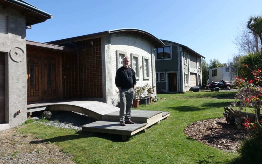 Tim Stephenson outside his red zoned house in Kairaki.