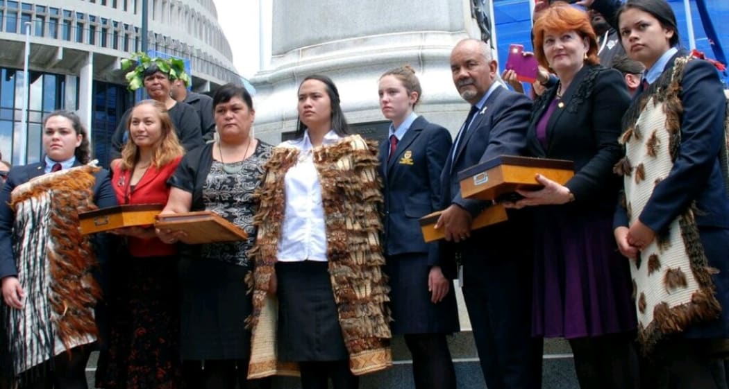 Leah Bell and Waimarama Anderson presenting their petition to parliamentarians