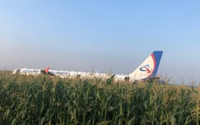 In this handout video grab released by Russian Investigative Committee, the Airbus A321, which made a hard landing in a corn field near Zhukovsky International Airport, is pictured in Moscow region, Russia.