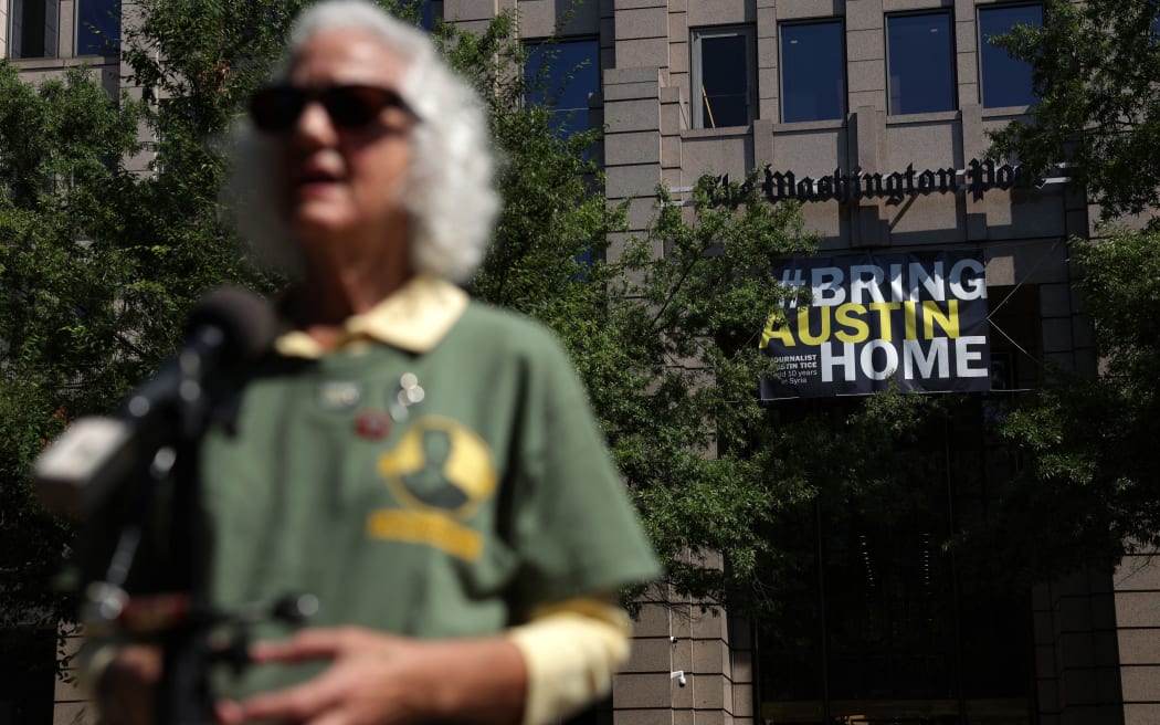 WASHINGTON, DC - AUGUST 09: Debra Tice, mother of freelance journalist Justin Tice, speaks to members of the media during an event to unveil a “#BringAustinHome” banner outside the headquarters of The Washington Post August 9, 2022 in Washington, DC. The unveiling of the banner marks 10 years since Justin Tice was kidnapped while reporting in Syria on August 14, 2012.   Alex Wong/Getty Images/AFP (Photo by ALEX WONG / GETTY IMAGES NORTH AMERICA / Getty Images via AFP)