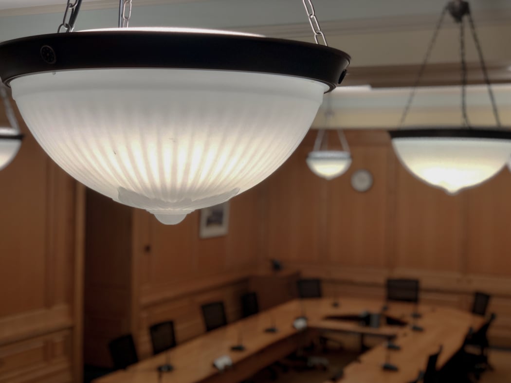 The period light shades in Parliament's old Select Committee Rooms hang like jellies about to fall