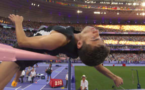 New Zealand's Hamish Kerr competes in the men's high jump final of the athletics event at the Paris 2024 Olympic Games at Stade de France in Saint-Denis, north of Paris, on August 10, 2024. (Photo by Antonin THUILLIER / POOL / AFP)