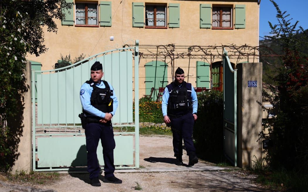 Gendarmes stand outside the house of the grandparents of Emile Soleil, a French toddler who was found dead after going missing in 2023, amidst the property's search as part of the investigation into the boy's death, in La Bouilladisse, southeastern France, on March 25, 2025. A long investigation into the mysterious death in 2023 of a French toddler took a surprise turn March 25, 2025, when police arrested the boy's grandparents on suspicion of murder. The death of Emile Soleil, a two-and-a-half year old boy who went missing while at the summer home of his grandparents in the French Alpine hamlet of Le Haut-Vernet in July 2023, had remained unexplained even after the discovery of his skull and teeth by a walker nine months after his disappearance 1.7 kilometres (1.1 miles) from the village. (Photo by Clement MAHOUDEAU / AFP)