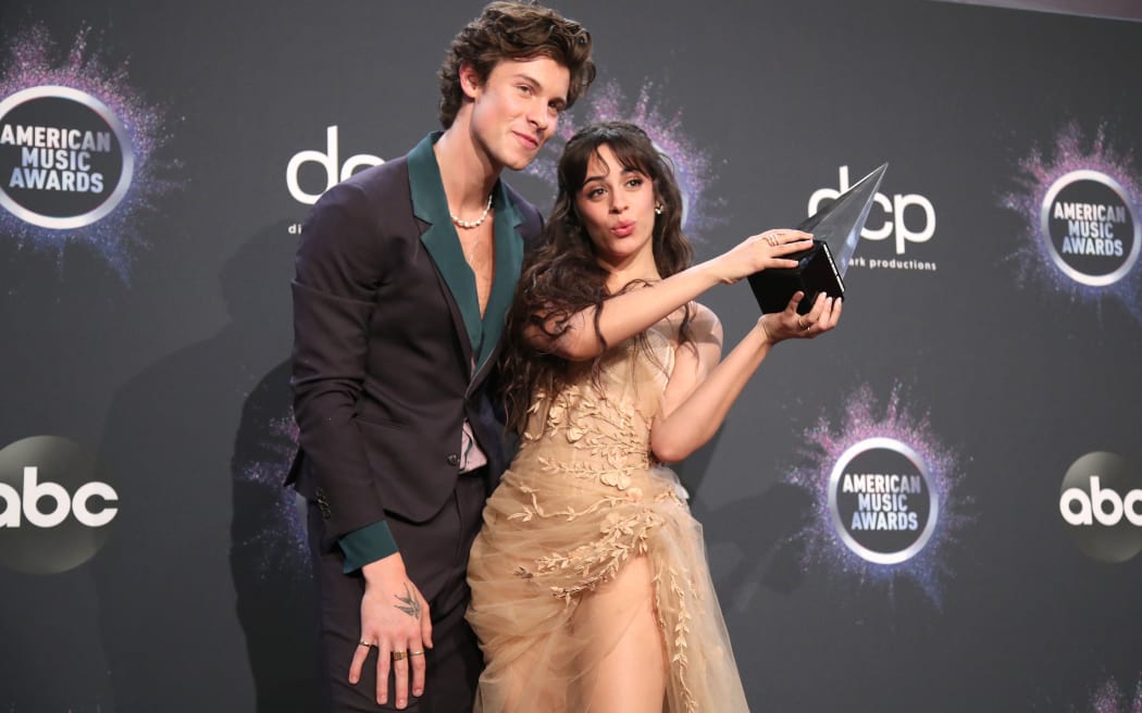 Shawn Mendes and Camila Cabello, winners of the Collaboration of the Year award for Senorita, at the 2019 American Music Awards at Microsoft Theater on November 24, 2019 in Los Angeles, California