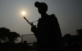 Indian Border Security Force (BSF) personnel stand guard at the India-Pakistan Wagah Border, about 35km from Amritsar on September 29, 2016.
