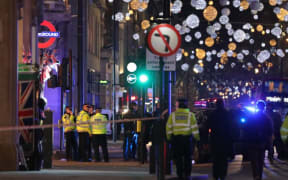 Police outside Oxford Circus underground station during the response.