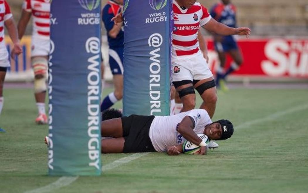 Fiji Warriors fly-half Jonetani Ralulu scores a try in their 39-16 win over Junior Japan.