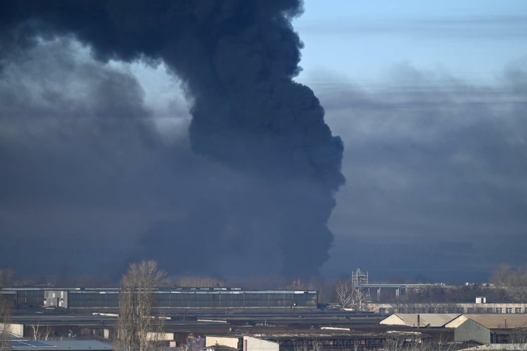 Black smoke rises from a military airport in Chuguyev near Kharkiv  on February 24, 2022.