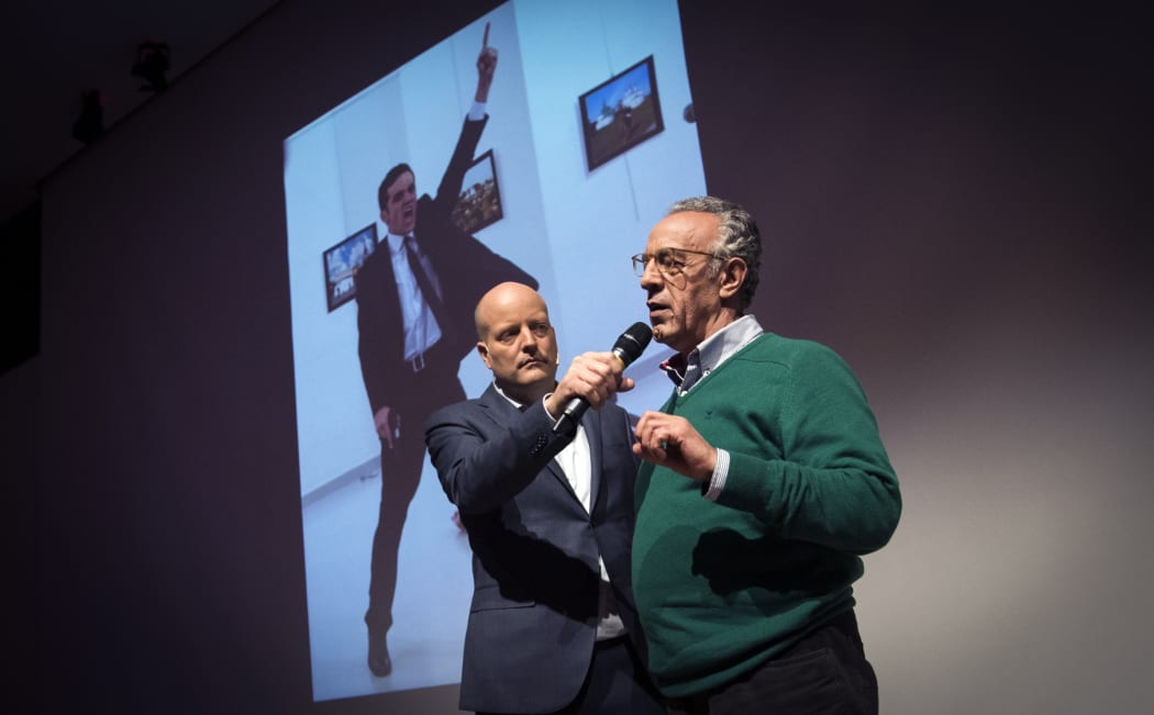 Photographer Burhan Ozbilici (R) won first prize at the annual World Press Photo awards for his image depicting the assassination of Russia's ambassador to Turkey, Andrei Karlov