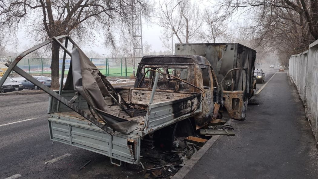 A photo shows damaged vehicle at a street aftermath of protests in Almaty of Kazakhstan, on January 09, 2022.