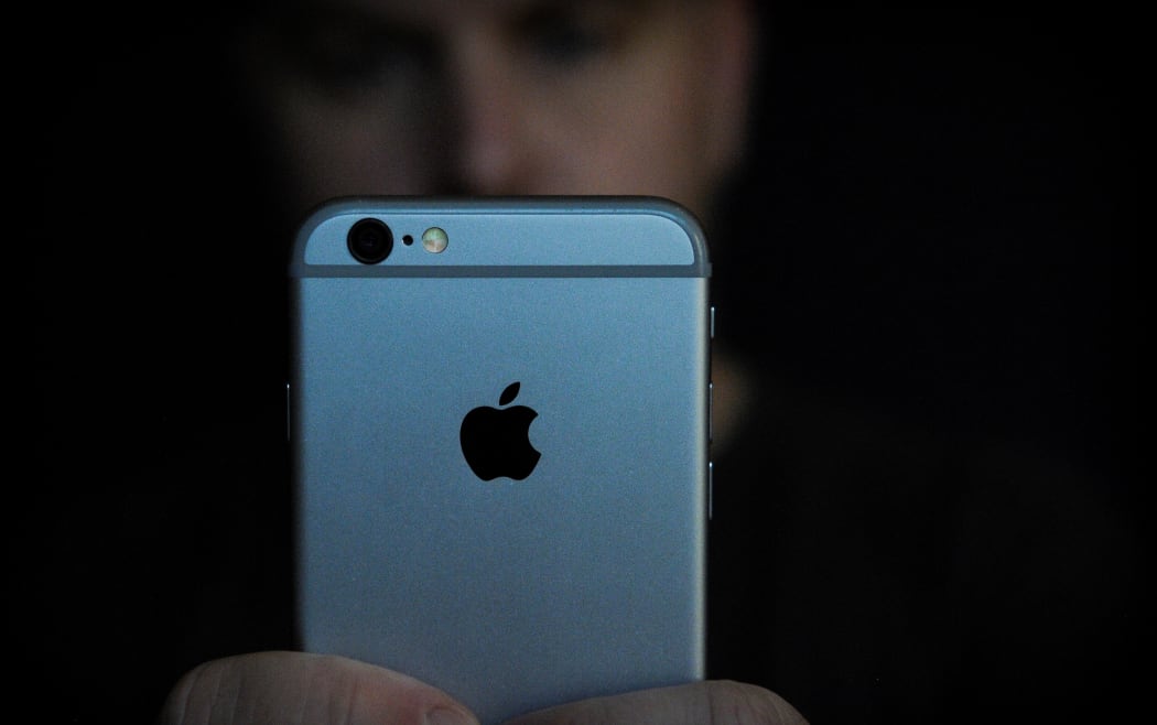 A man is seen using an iPhone on November 2, 2017. Concerns have been raised about Apple's new iPhone X and it's front facing camera with face recognition.