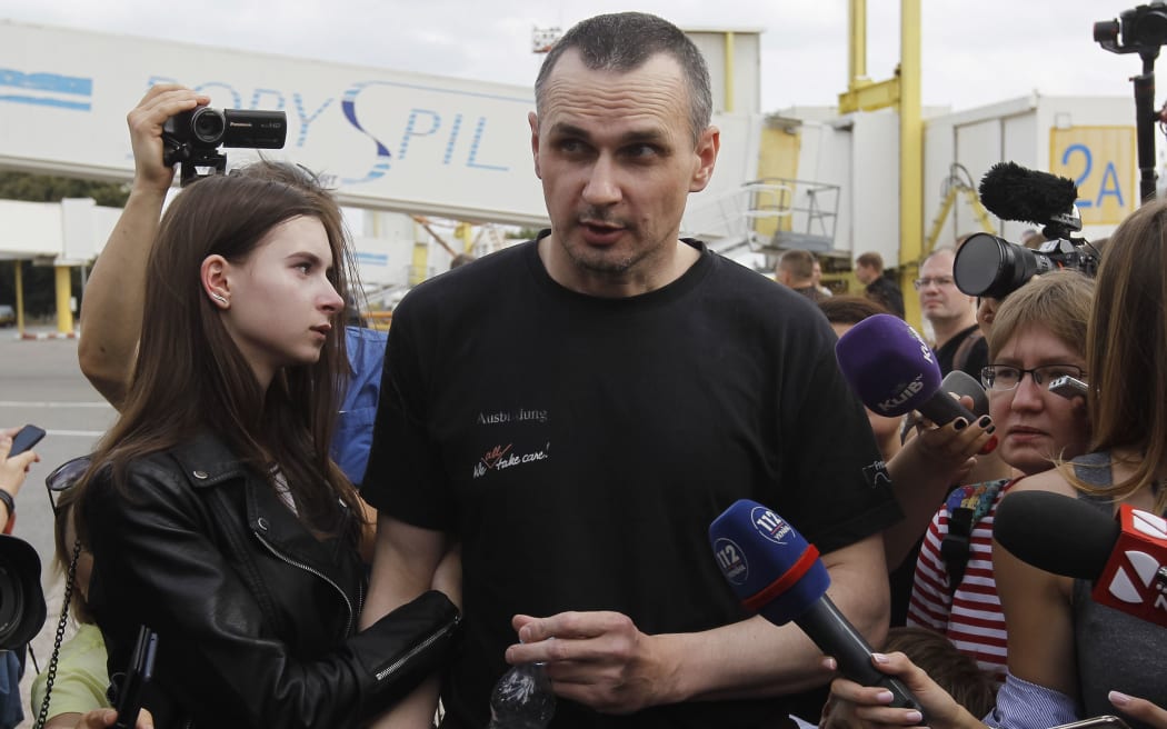 Ukrainian film director Oleg Sentsov, who was jailed on terrorism charges in Russia,  hugs his daughter Alina Sentsova, upon arrival after Russia-Ukraine prisoners swap, at Borispil International Airport near Kiev, Ukraine, on 07 September, 2019