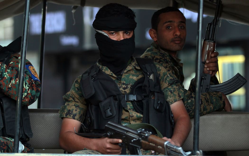 Yemeni soldiers guard the presidential palace in the capital Sanaa.