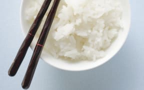 Bowl of rice with chopsticks (Photo by Foodcollection GesmbH / foodcollection / foodcollection via AFP)