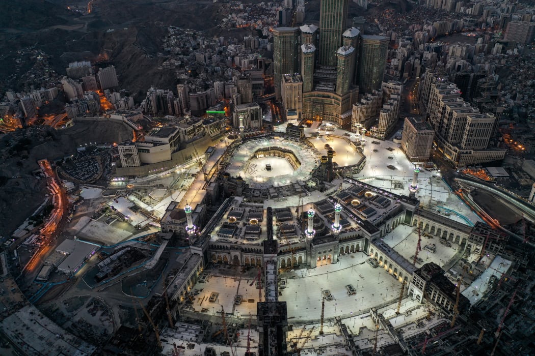 This picture taken during of Eid al-Fitr, which starts at the conclusion of Ramadan, shows the Grand Mosque and Kaaba in Mecca. Saudi Arabia began a five-day, round-the-clock curfew from May 23 after COVID-19 infections soared since the start of Ramadan to around 68,000.