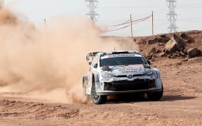Toyota Gazoo Racing World Rally Team's French driver Sebastien Ogier and French co-driver Vincent Landais steer their Toyota GR Yaris Rally1 during the last day of the FIA World Rally Championship (WRC) in Jeddah on November 29, 2025. (Photo by Fayez Nureldine / AFP)