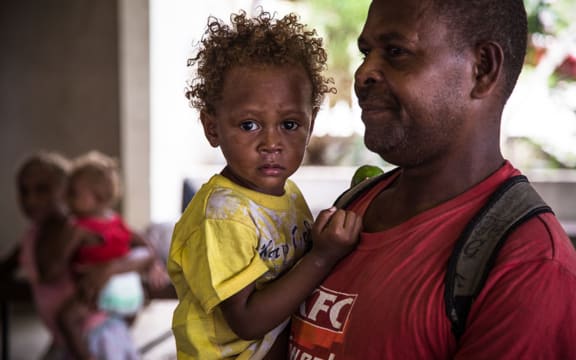 Families sheltering at the Panatina Pavilion evacuation centre in Honiara.