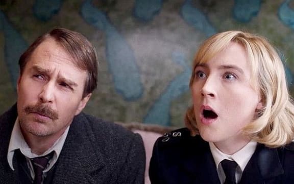 Sam Rockwell and Saoirse Ronan in the 2022 film See How They Run