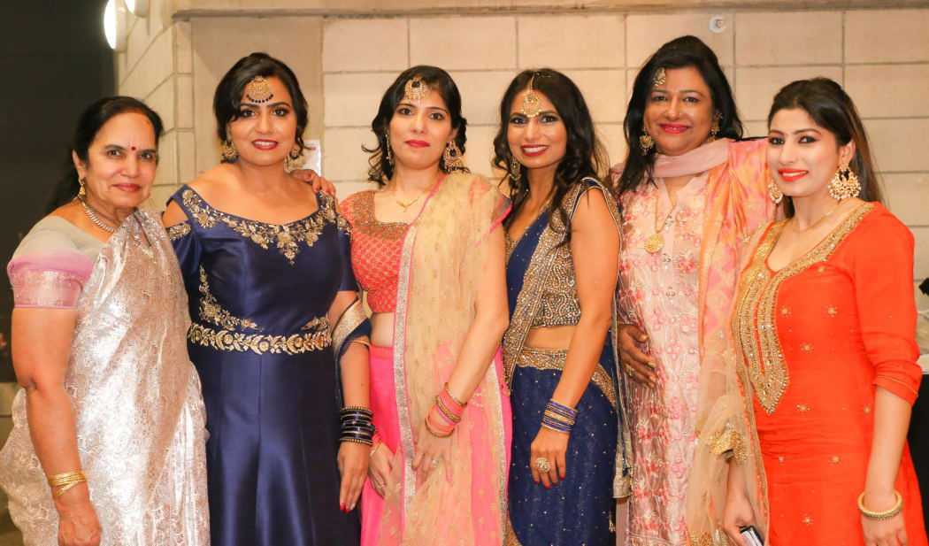 Baljit Dheil (second from left) Abha Khanna  (third from left) and Soni Dheil (third from right) have been celebrating their culture with other women.