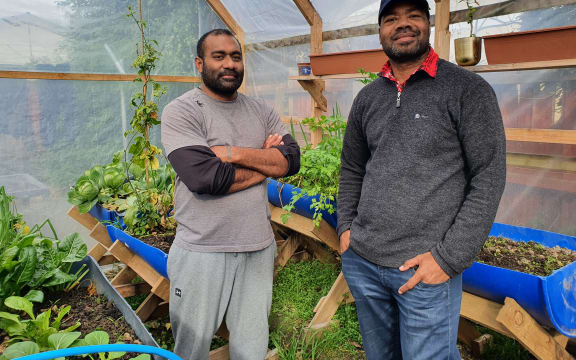 Mosese Vilivilioyawa (left) and Dr Esala Vakamacawai in the hothouse Mosese built.
