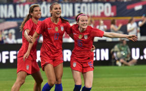 USA footballers Tobin Heath, Alex Morgan and Rose Lavelle.