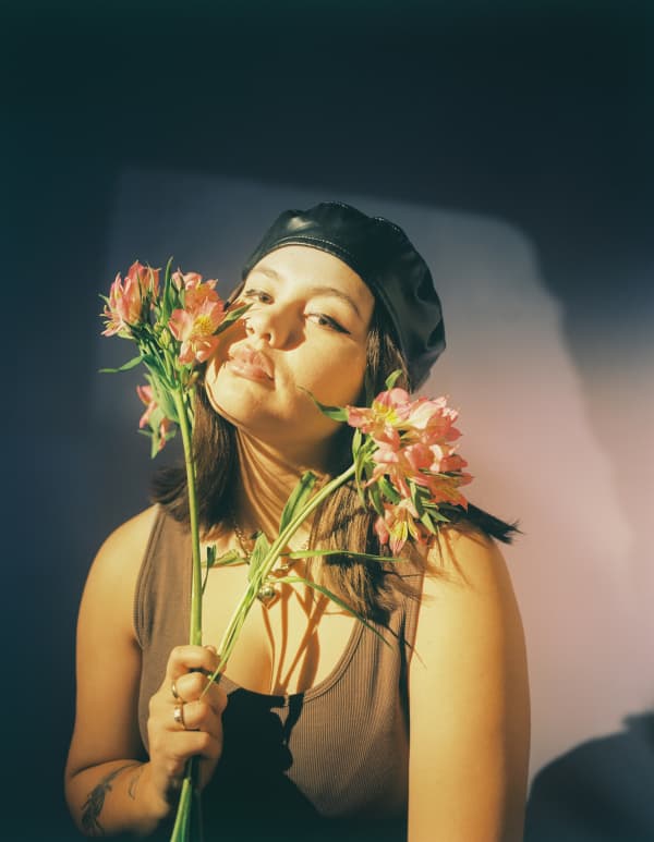 Paige, sniffing flowers