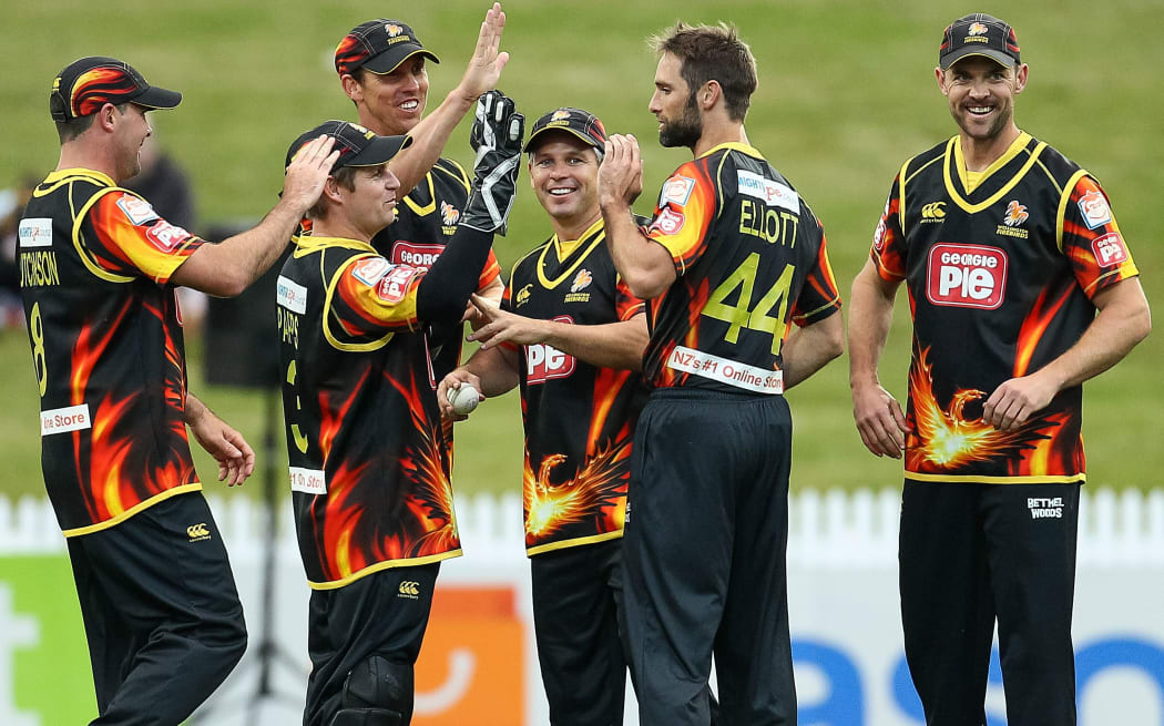 The Wellington Firebirds celebrate a wicket.