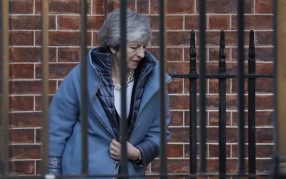 Britain's Prime Minister Theresa May leaves from the rear of 10 Downing Street in London on February 14, 2019 ahead of a vote on amendments to the Brexit withdrawal bill. (Photo by Tolga AKMEN / AFP)