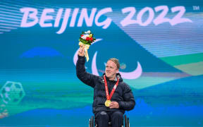 Gold medalist Corey Peters of New Zealand poses during the awarding ceremony for the para alpine skiing Men's Downhill Sitting of Beijing 2022 Paralympic Winter Games at Yanqing Medals Plaza of the Winter Paralympics in Yanqing District, Beijing, March 5, 2022.