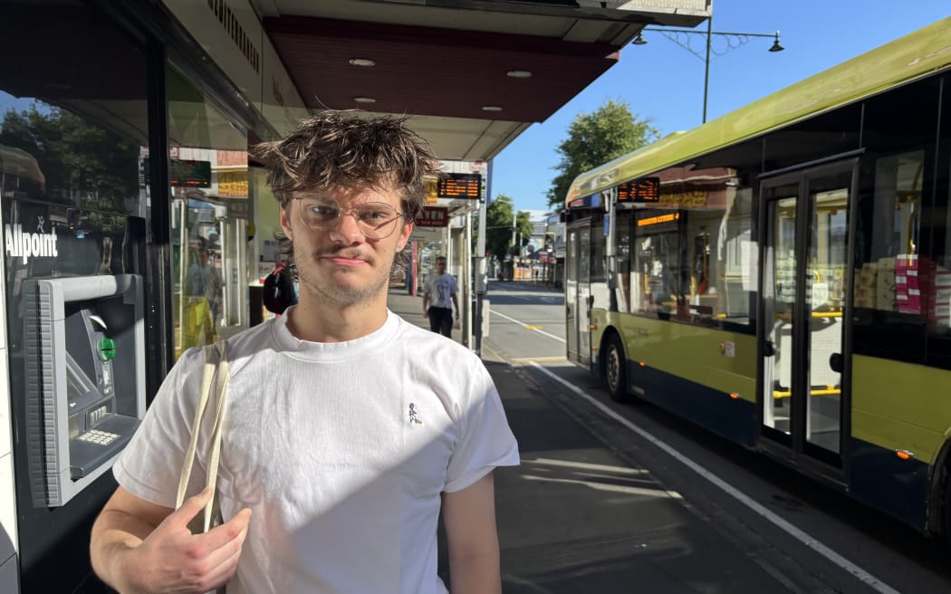 Ben Lake waits for a bus in Wellington.