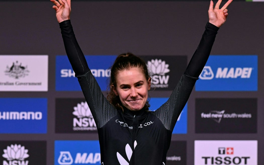 Niamh Fisher-Black of New Zealand celebrates on the podium after winning the U23 women's road race cycling event at the UCI 2022 Road World Championship in Wollongong.