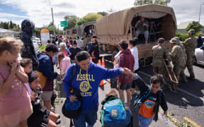 About 11 army trucks carrying dozens of people arrived at the Hastings Sports Centres on Wednesday after Cyclone Gabrielle left thousands displaced in Hawke's Bay.