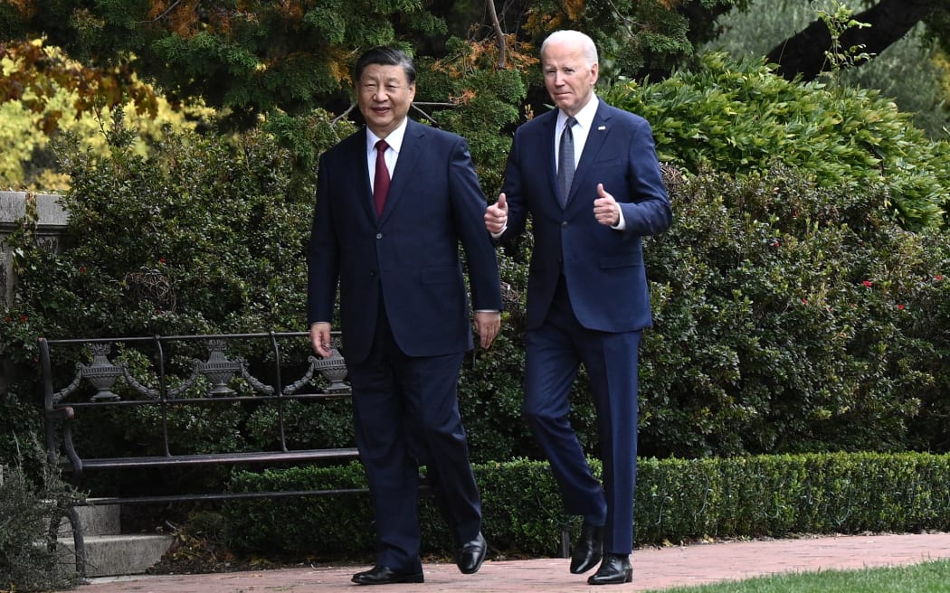 US President Joe Biden and Chinese President Xi Jinping walk together after a meeting during the Asia-Pacific Economic Cooperation (APEC) Leaders' week in Woodside, California on November 15, 2023.