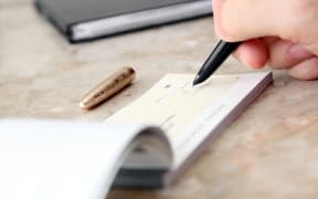 Cheque being signed