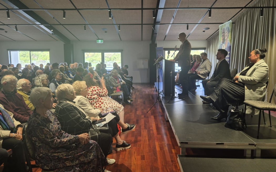 People watch Auckland mayoral event in Northcote.