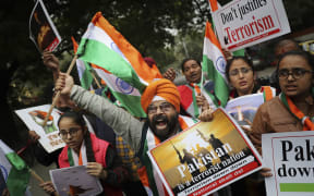 A National Akali Dal leader shouts slogans in support of India and against Pakistan as he celebrates reports of Indian aircrafts bombing Pakistan territory, in New Delhi, India.