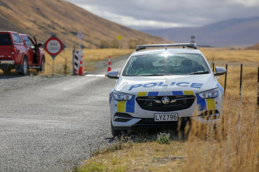 Police at the cordon leading to the crash scene.