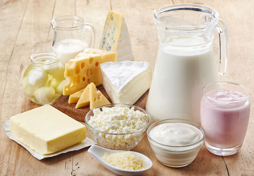 Various fresh dairy products on wooden background