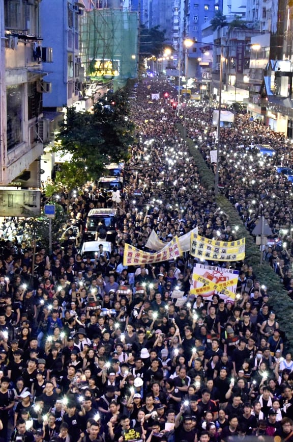 Tens of thousands of people dressing in black, are taking the streets to protest against an extradition law bill in the evening in Hong Kong, China on June 16, 2019.