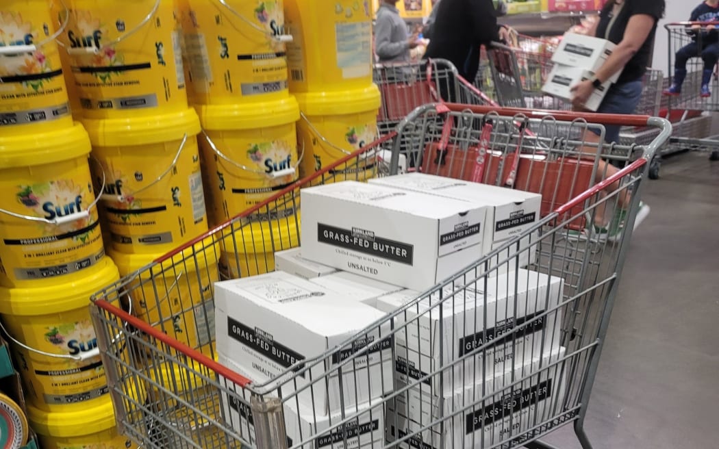 Boxes of 1kg blocks of Kirkland butter at Costco in a trolley