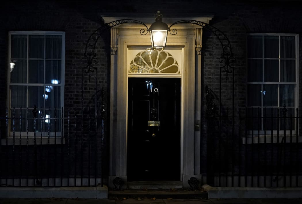 The closed front door to 10 Downing Street is pictured in central London, on October 20, 2022, hours after UK's Prime Minister Liz Truss resigned as leader of the Conservative Party. - British Prime Minister Liz Truss announced her resignation on after just six weeks in office that looked like a descent into hell, triggering a new internal election within the Conservative Party. (Photo by Niklas HALLE'N / AFP)