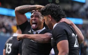 Leicester Fainga'anuku of the All Blacks celebrates a try by Wallace Sititi against Ireland in Chicago, 2025.