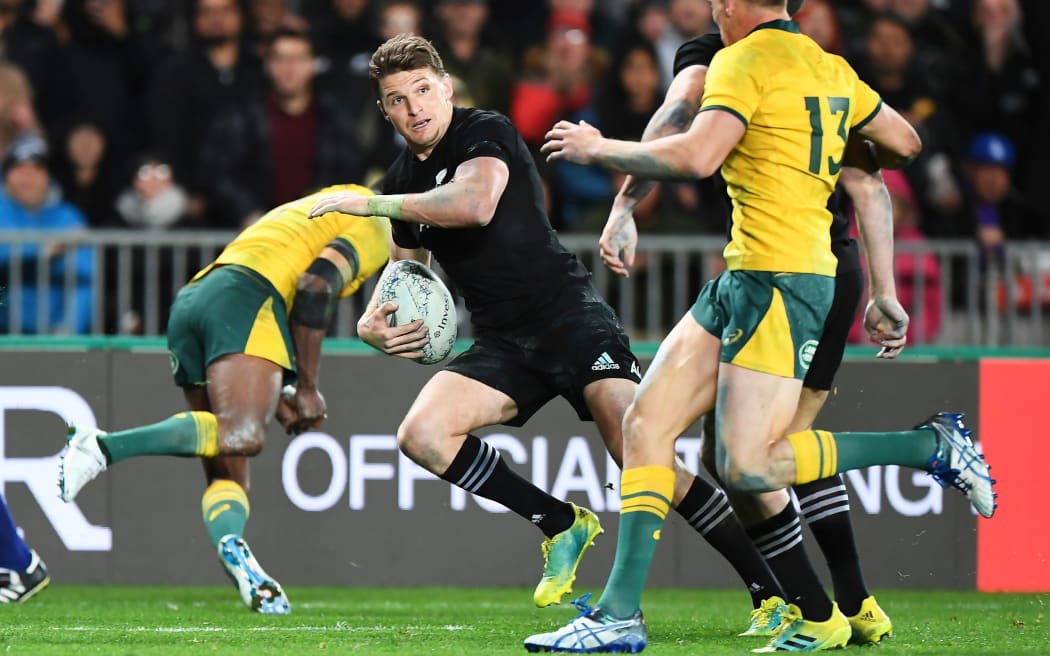 All Blacks first five Beauden Barrett eludes Wallaby defenders.