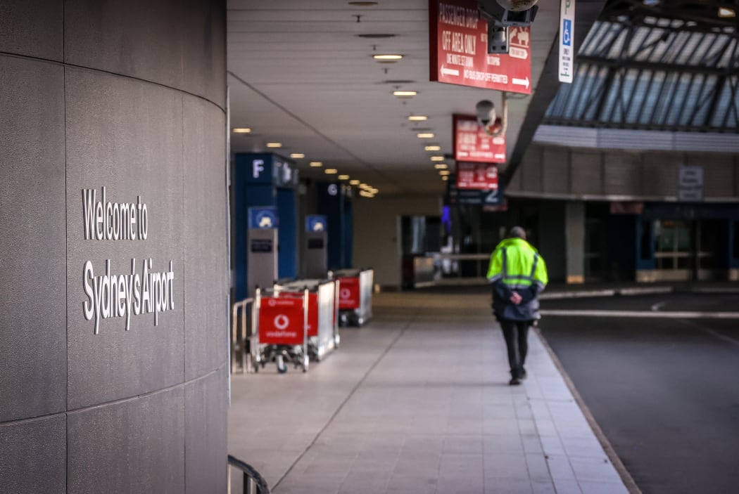 (File photo) A security guard outside the departures area of the Sydney International Airport in Sydney, 29 September 2020.