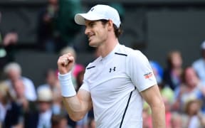 Andy Murray celebrates beating Australia's Nick Kyrgios on the eighth day of the 2016 Wimbledon Championships at The All England Lawn Tennis Club in Wimbledon, southwest London, on July 4, 2016. 
LEON NEAL / AFP