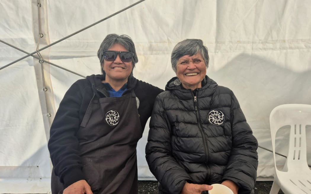 Time for a kaputī: Riingi Matatahi (left) was taught 'how to make sandwiches properly' by her mother Tutata, who now gets to sit down, have a kaputī, and enjoy the beef, egg, and chutney deliciousness, at day 3 of the tangihanga for Kiingi Tuheitia.